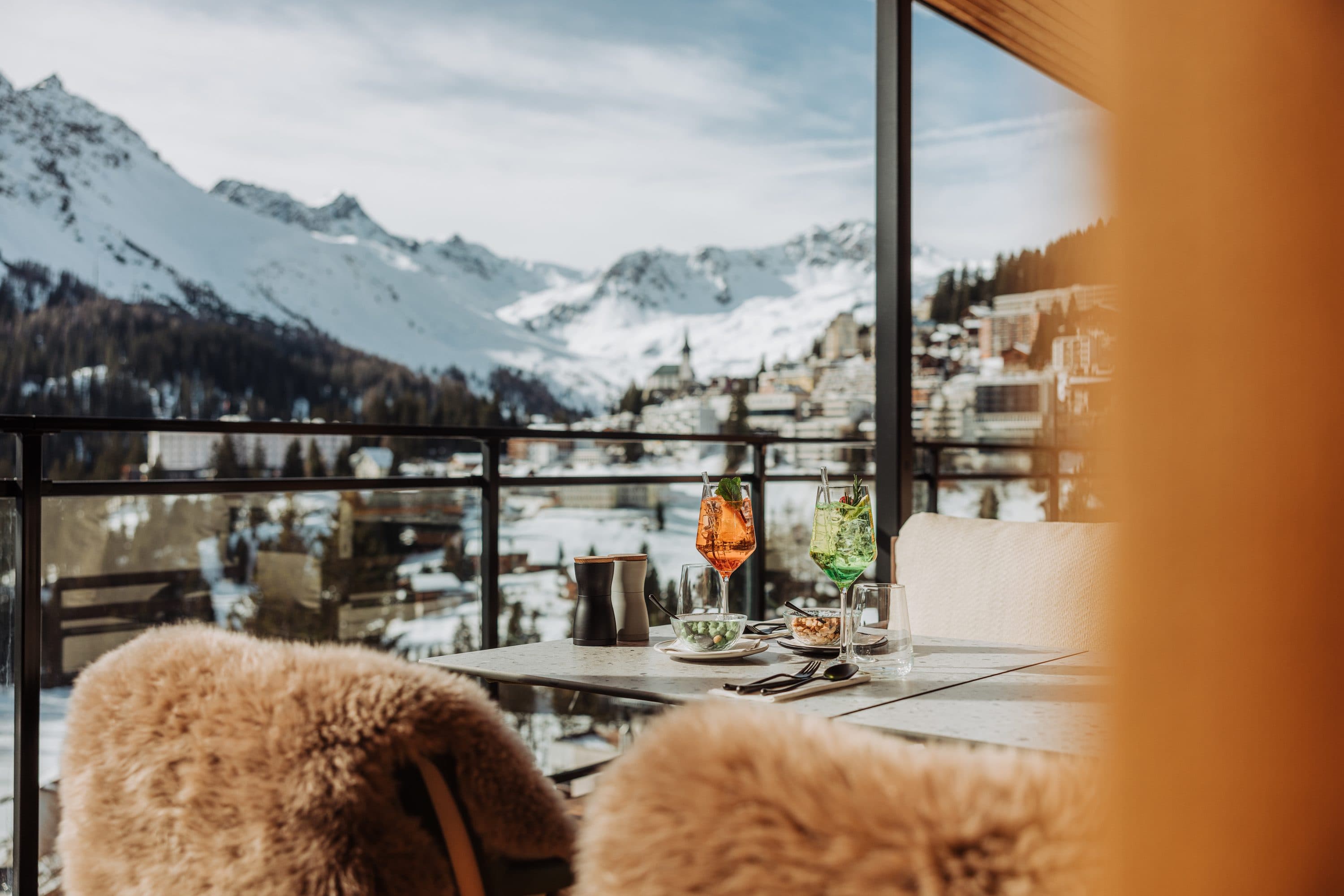 A welcoming lounge with a mountain-view window
