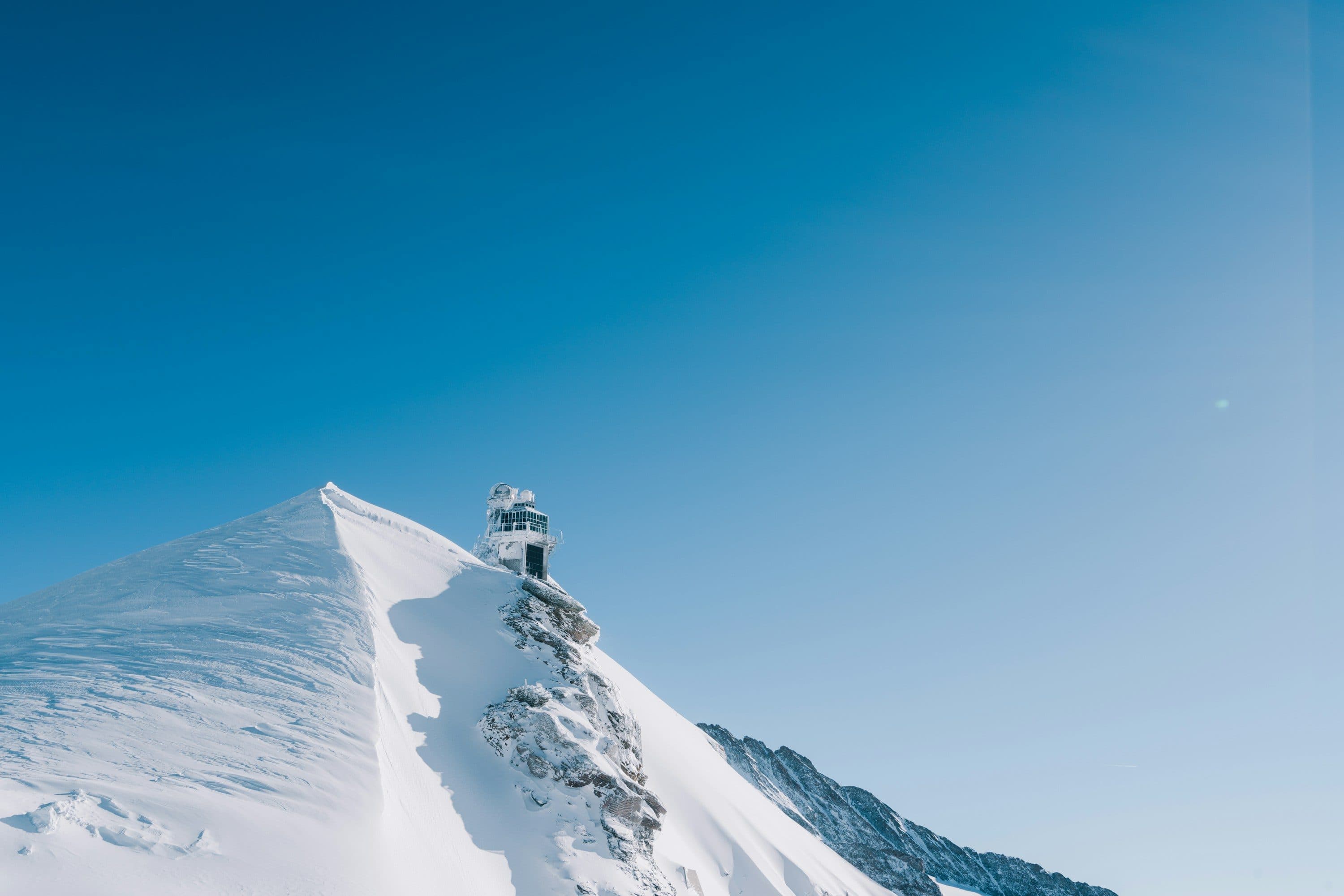 The Sphinx observatory on a snow-covered Jungfrau ridge